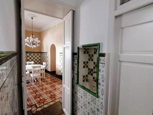a door leading into a dining room with a table at Casa Mendoza in Santa Cruz de la Palma