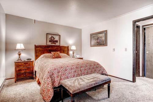 a bedroom with a bed with a cat on it at The Forest Neighborhood by Keystone Resort in Keystone