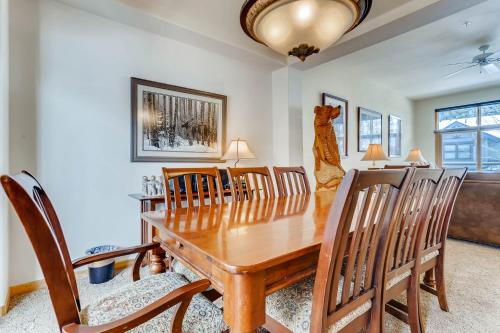 a dining room with a wooden table and chairs at The Forest Neighborhood by Keystone Resort in Keystone