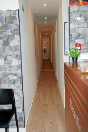 a hallway in a office with a mirror on the wall at Amor Lisboa Hostel in Lisbon