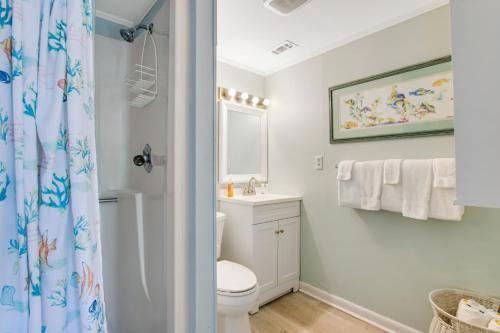a bathroom with a toilet and a sink at Beach Cottage on Jones in Tybee Island