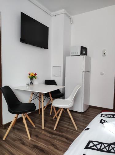 Телевизор и/или развлекательный центр в Fanea Residence