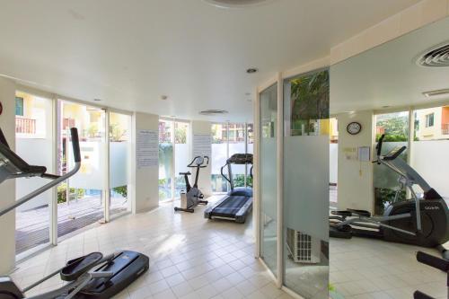 a gym with treadmills and elliptical machines at Mykonos Condo in Hua Hin
