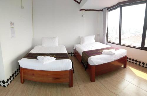 Postel nebo postele na pokoji v ubytování SD View Hotel