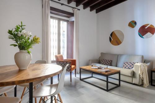 Et opholdsområde på Triana Boutique Apartments by Hommyhome