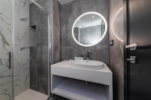 a bathroom with a sink and a mirror at Marello in Promajna
