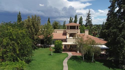 an aerial view of a house with a yard at Casa Agostino - Luxury wine resort in Mendoza