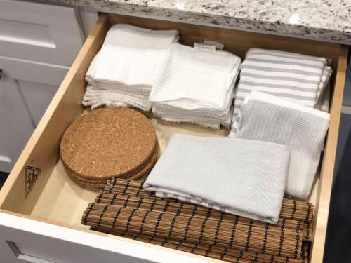 a drawer filled with towels and a counter top at Beautiful Home across the street from Lake June! in Lake Placid