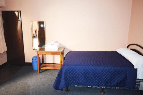 Katil atau katil-katil dalam bilik di Hotel Realidad