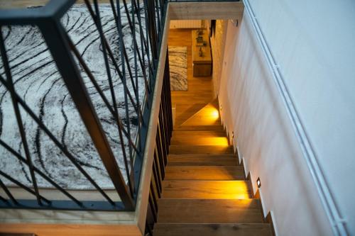 a staircase in a house with lights on it at Golden House in Kolašin