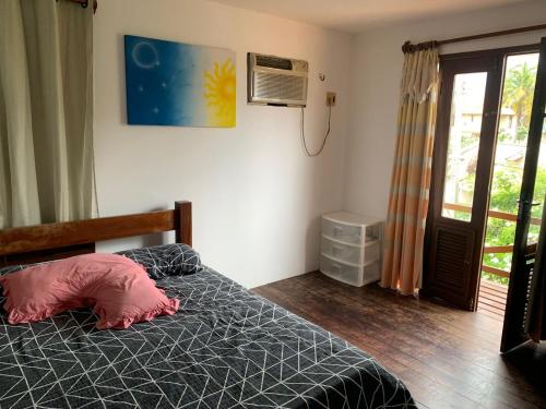 Postel nebo postele na pokoji v ubytování Excelente casa na Praia do Coqueiro com 4 suítes a 100m da praia
