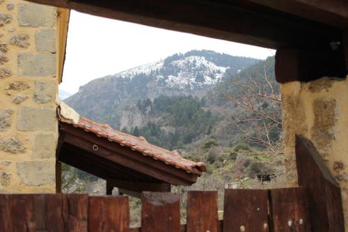 a view of a mountain from a window of a building at Εν Αρχή - En Arhi in Ano Trikala