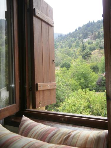 a window with a view of a mountain at Εν Αρχή - En Arhi in Ano Trikala