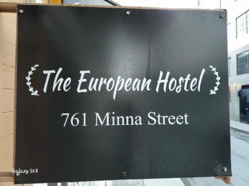 a sign for the european hospital minivan street at European Hostel in San Francisco