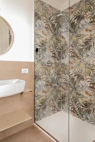 a bathroom with a shower and a sink at Palazzo Ventimiglia Lodge & Suites in Palermo
