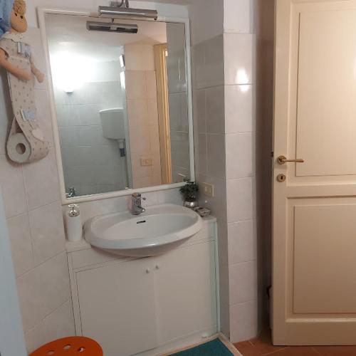 a bathroom with a sink and a mirror at In Vacanza a Gaeta - MariNella in Gaeta