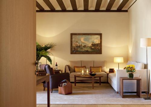 a living room with a couch and a table at Abadia Retuerta LeDomaine in Sardoncillo