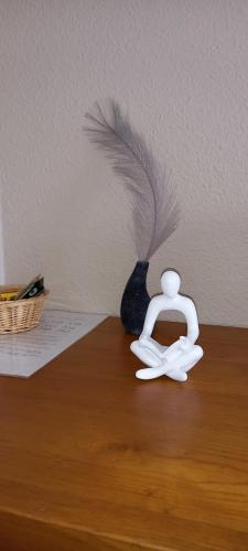 a white object sitting on top of a wooden table at Chez Louis chambres d'hôtes à la ferme in La Canourgue