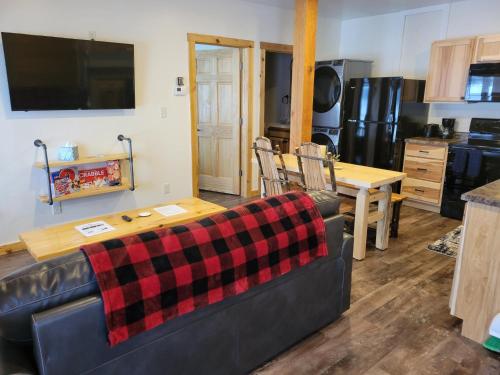 a living room with a couch and a table at Keweenaw Waters Resort in Houghton