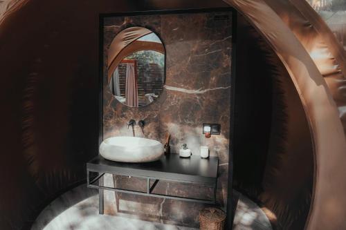 a bathroom with a sink and a mirror at Noctis Hotel in Soria