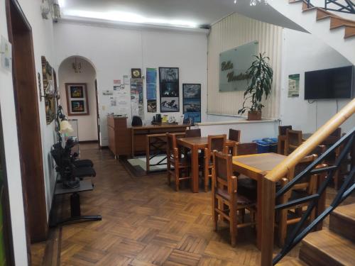 a restaurant with tables and chairs in a room at Hotel Bella Montaña in Manizales