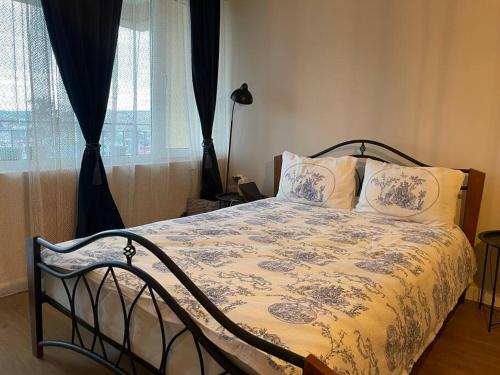 a bedroom with a bed with pillows and a window at Annabella’s place in Veliko Tŭrnovo