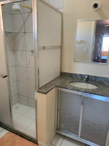 a bathroom with a shower and a sink at ALOHA LAGOON CABO FRIO in Cabo Frio