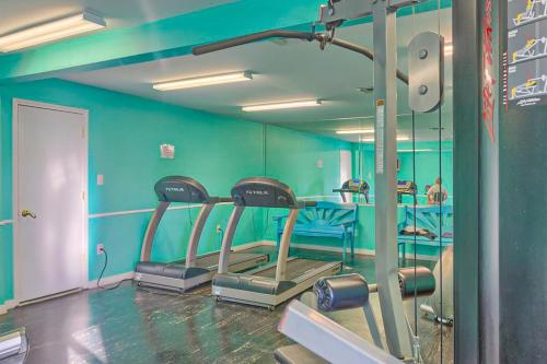 a gym with several treadmills in a room at Seaside Beach and Racquet Club Condos II in Orange Beach