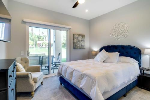 a bedroom with a large bed and a balcony at Golf Haven with Pool Access - 5 Mi to Palm Springs in Cathedral City