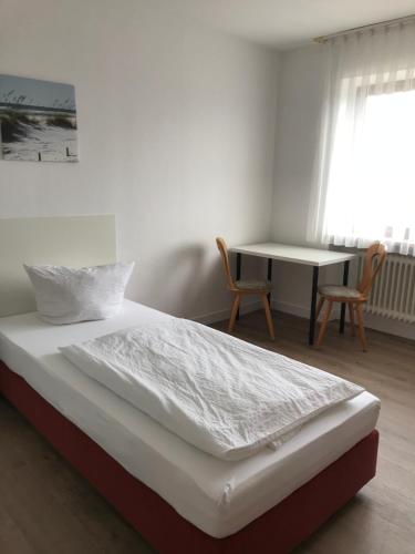 Ένα ή περισσότερα κρεβάτια σε δωμάτιο στο Landgasthof Felsenkeller