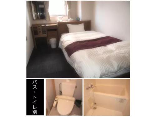 een hotelkamer met een bed en een wastafel bij Toss Station Hotel Matsuzaka - Vacation STAY 52279v in Tosu