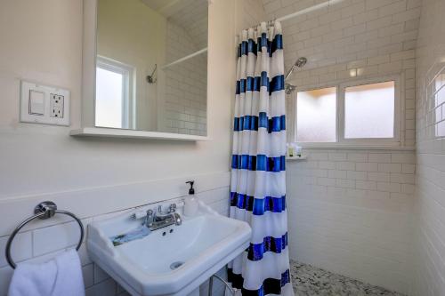 a bathroom with a sink and a shower curtain at OB Beach Daze 2 in San Diego