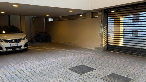 a garage with a car parked next to a garage door at Indipendent Studio Apartment with Terrace - Parking in Florence