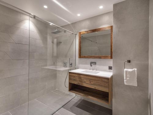 a bathroom with a sink and a shower at Appartement Les Allues-Méribel, 5 pièces, 10 personnes - FR-1-566-2 in Les Allues