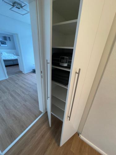 an open door to a closet in a room at Ferien Bungalow Ennens in Rhauderfehn
