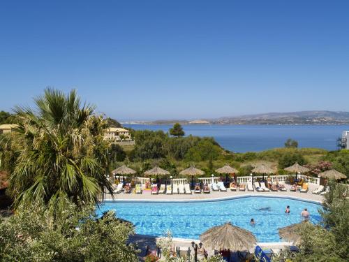 a large swimming pool with a view of the water at Lorenzo House Apartments in Lassi