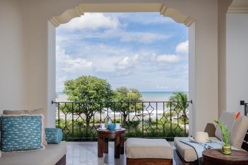 a living room with a view of the ocean at Rancho Santana in El Limón