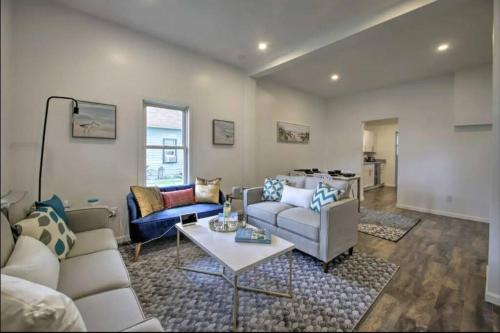 a living room with a couch and a table at Dunes Home 3 Bedroom I 2 Baths I 2 Living rooms in Chesterton