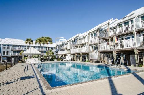 a large swimming pool in front of a building at LaBahia 224 in Pensacola Beach