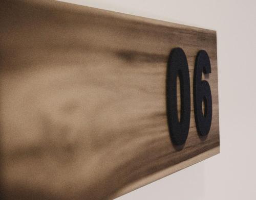 a wooden clock with the number forty on it at Cactus Suites Kythnos in Mérikhas