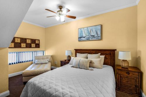 a bedroom with a bed and a ceiling fan at Palm Beach Club 3-235 in Pensacola Beach