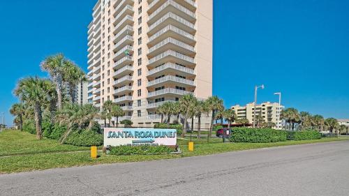 a sign in front of a large apartment building at Santa Rosa Dunes 425 in Pensacola Beach