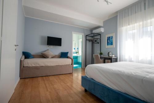 Postel nebo postele na pokoji v ubytování Alma Sorrento Suite