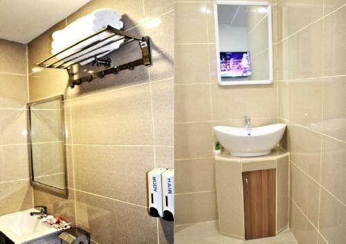 bagno con lavandino e specchio di ECO HOTEL at BUKIT BINTANG a Kuala Lumpur