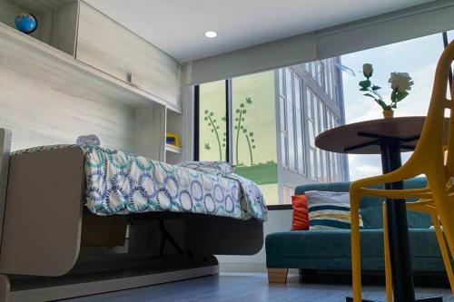 מיטה או מיטות קומותיים בחדר ב-APTOTIV209 - Espectacular aparta estudio tipo loft - Chapinero - Wifi - TV