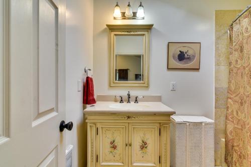 a bathroom with a sink and a mirror at Cozy Portland Studio with Patio and Yard! in Portland