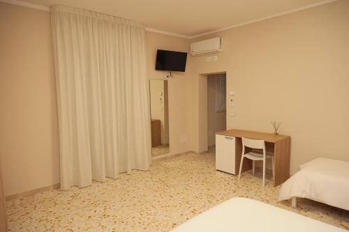 Ένα ή περισσότερα κρεβάτια σε δωμάτιο στο Bed and Breakfast Dimora Peluso