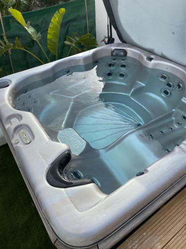 a bath tub with a drain in it at Hôtel La Villa Patricia - Charme et Tradition in Villefranche-sur-Mer