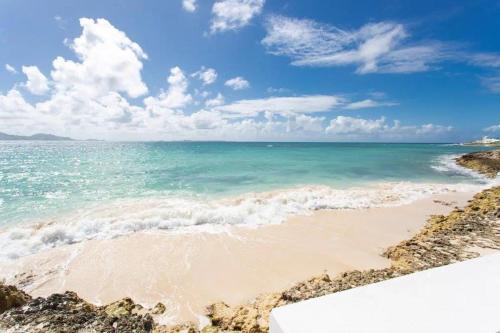 a view of the ocean on a beach at Anguilla - Villa Anguillitta villa in Blowing Point Village