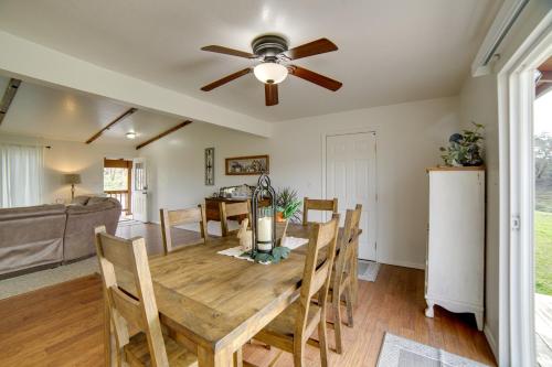 a dining room with a table and a ceiling fan at 30-Acre Witter Springs Ranch with Barn and Views! in Upper Lake